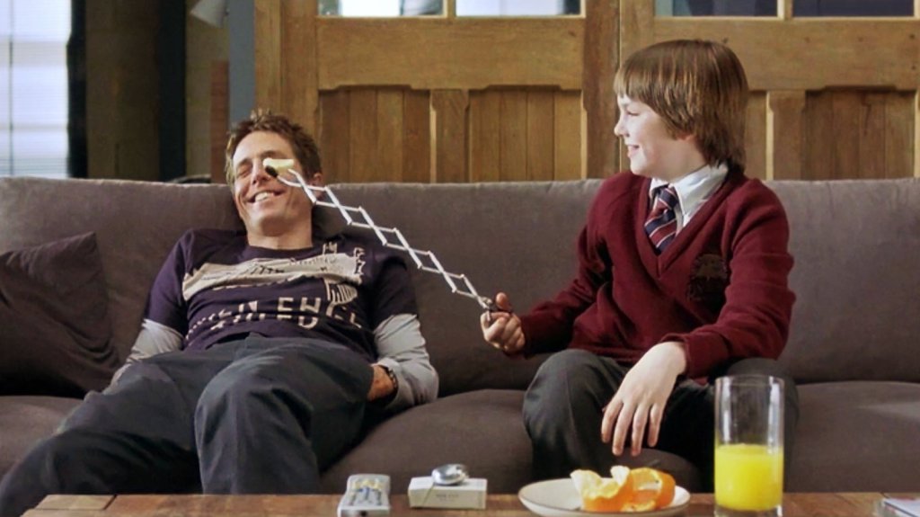Hugh Grant (left) and Nicholas Hoult (right) in About a Boy (2002).