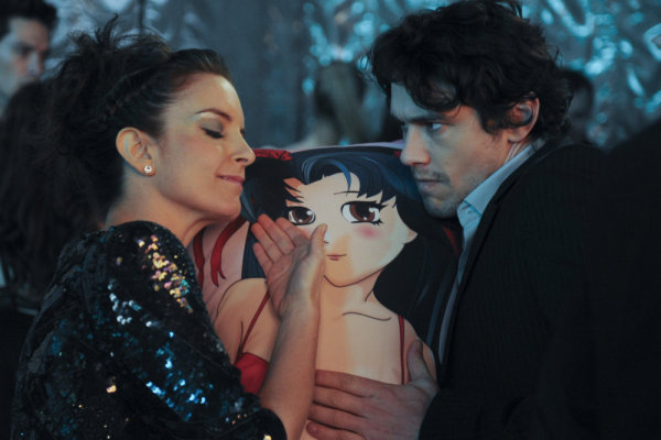 Tina Fey (left) and James Franco (right) dancing with a Japanese body pillow on 30 Rock. 